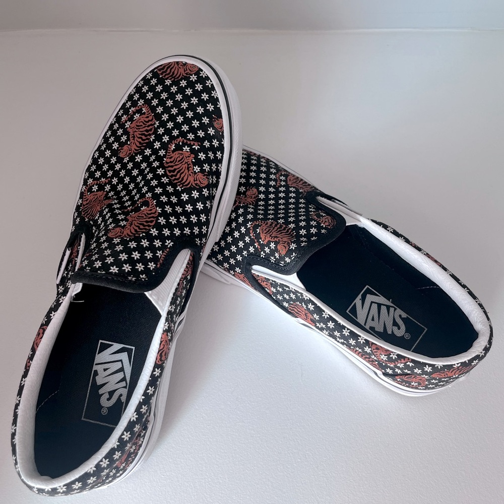 Women’s Vans Black and Orange Tiger Print Slip-Ons